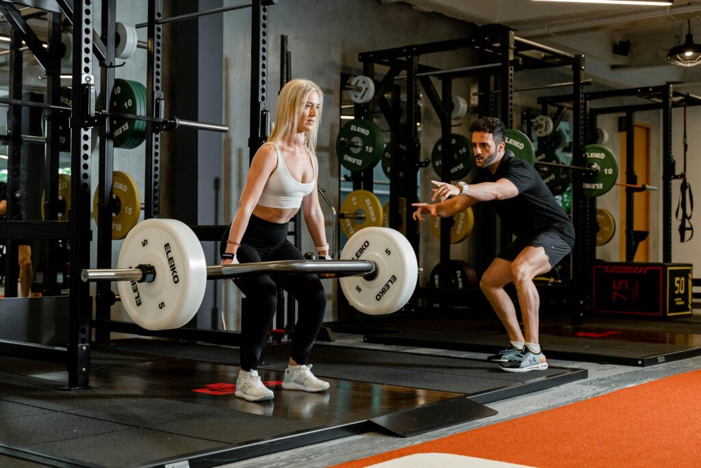 woman doing deadlifts back pain